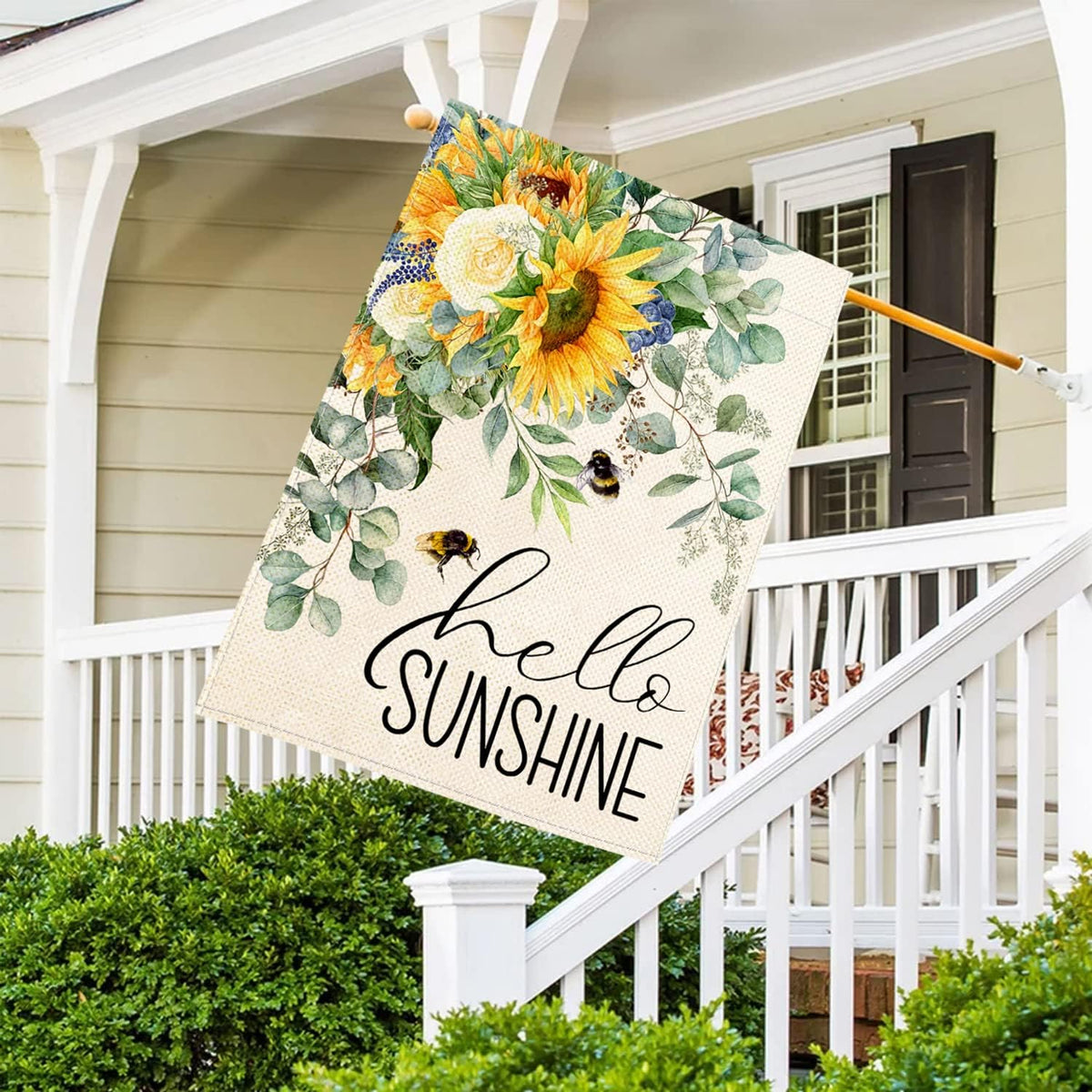 Baccessor Hello Sunshine flag with eucalyptus leaves offers fresh outdoor decor.