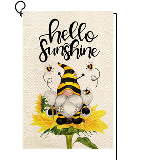 Baccessor Hello Sunshine flag with sunflowers and a gnome welcomes guests in sunny gardens.