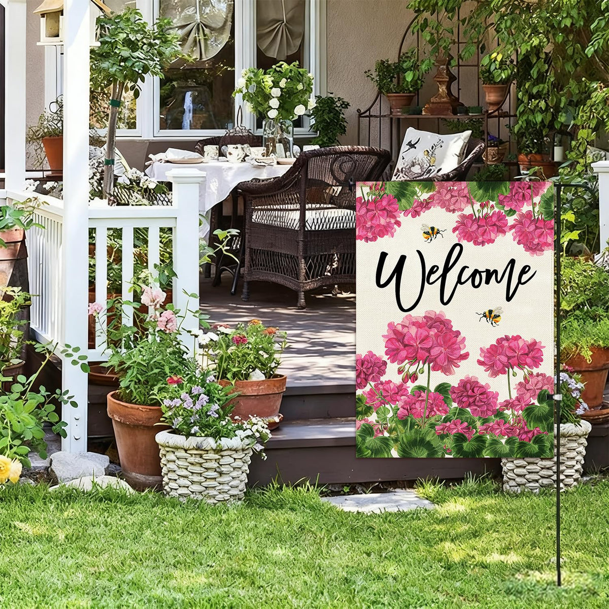 Baccessor spring-summer garden flag on a pole for porch decor.
