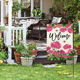 Baccessor spring-summer garden flag on a pole for porch decor.