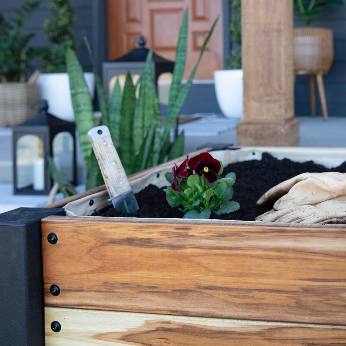Backyard Discovery ready-to-assemble teak planter makes balcony setup quick.