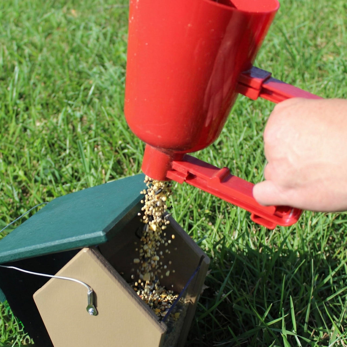 Backyard Essentials bird seed scoop in action with quick release.
