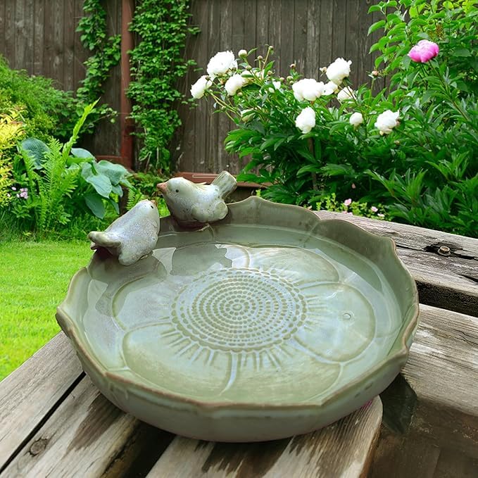 Bakayoyo ceramic bird bath in outdoor green blends with garden scenery, inviting birds to drink and bathe.