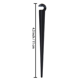 Balter-D irrigation stake ground insertion shown for secure tubing placement.