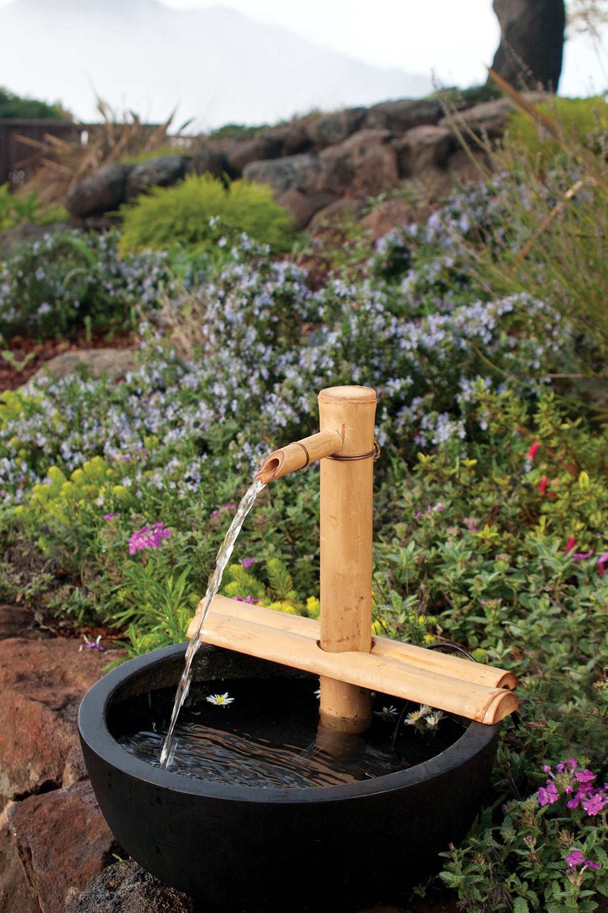 Bamboo Accents handcrafted bamboo spout adds natural texture to spaces.