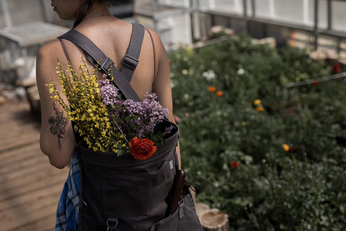 Barebones harvesting bag side view demonstrates portable design with adjustable strap.
