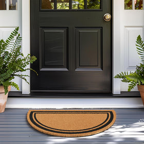 Barnyard Designs coir doormat texture helping scrape dirt at outdoor entrances.