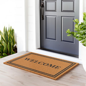 Barnyard Designs heavy-duty backing ensures mat stays put on porches.