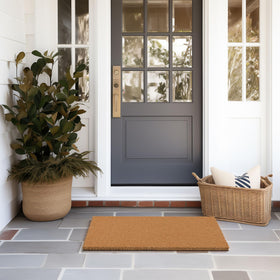 Barnyard Designs plain brown welcome mat complements any entryway style
