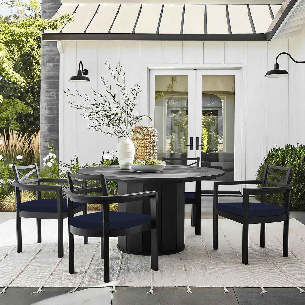 Four navy Basic Beyond cushions add soft seating to outdoor chairs.
