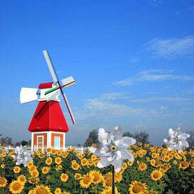 BATTIFE Sparkly laser effect pinwheel shines in sunlight for captivating yard decor.