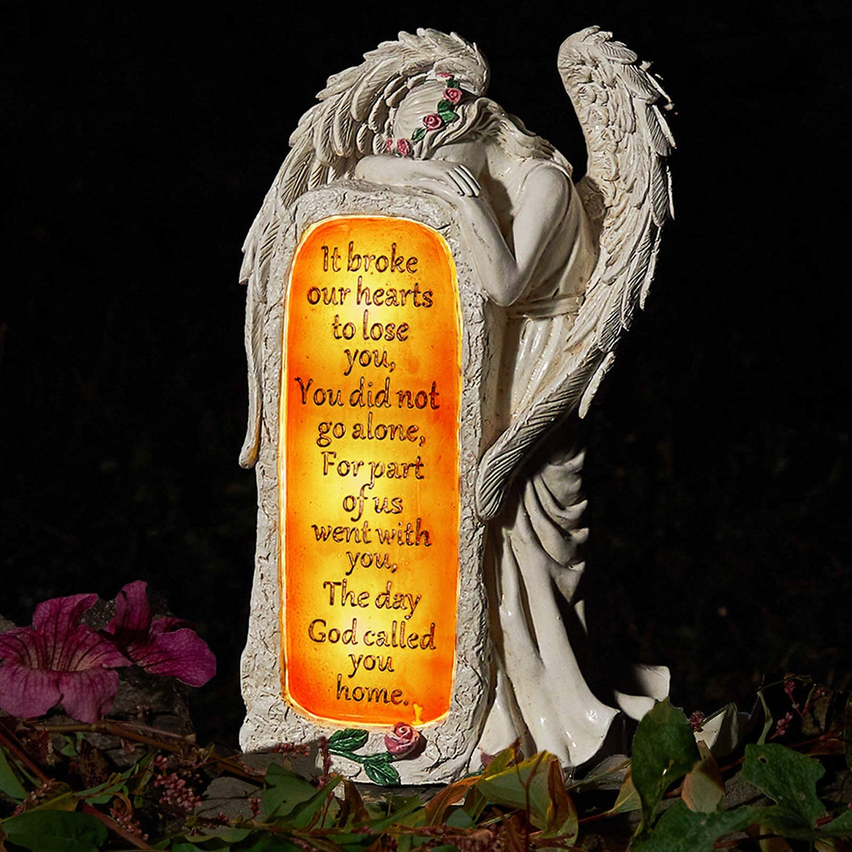 Bayn angel garden statue with solar panel back powering gentle evening glow