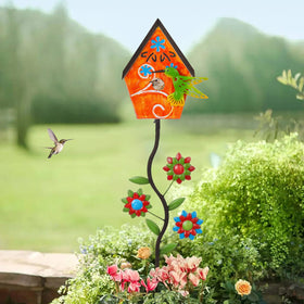 BAYN garden decor featuring orange house and flowers adds outdoor charm.