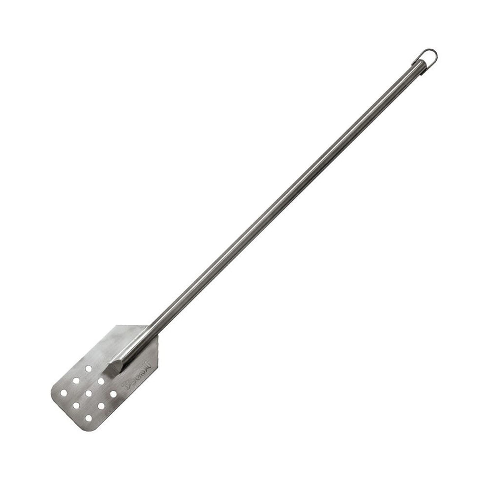 Bayou Classic 1042 stainless stir paddle deep in a large boil pot for thorough mixing.