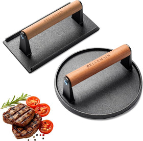 Bellemain heavy-duty cast iron grill press on a hot griddle for an even sear