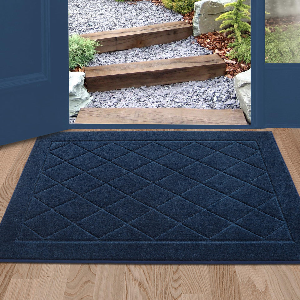 BEQHAUSE Dirt Trapper front-door doormat demonstrates absorbent fibers catching moisture.