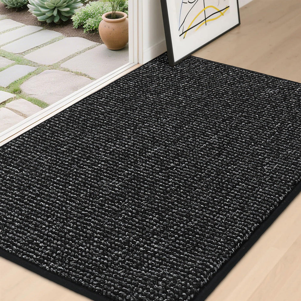 BEQHAUSE Dirt Trapper front door mat traps dirt and keeps entry floors dry.