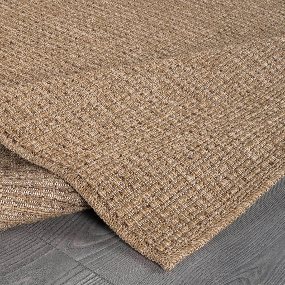 Beverly Rug Easy Jute Natural 9x12 in dining area emphasizes spill-friendly practicality.
