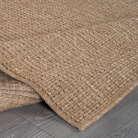 Beverly Rug Easy Jute Natural 9x12 in dining area emphasizes spill-friendly practicality.