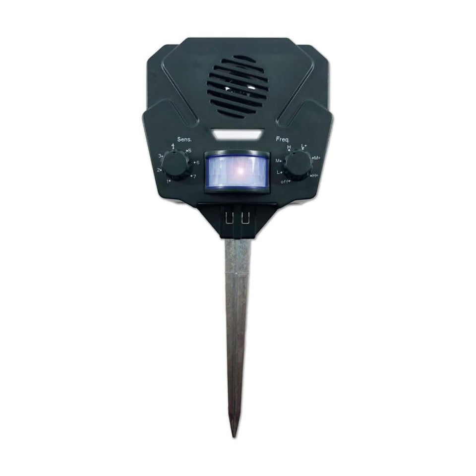 Bird-X Solar Yard Gard outdoor unit in sunny garden providing deterrence against wildlife