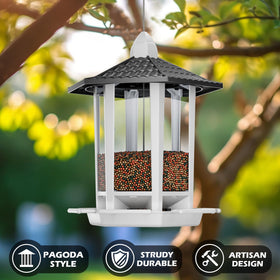 Birdream pagoda feeder in garden attracts cardinals and goldfinches.