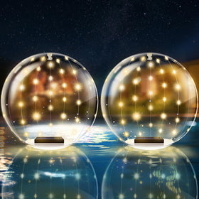 BITIWEND solar floating orb light glows on water, creating a cozy pool ambience.