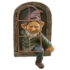 Bits and Pieces elf out the window tree hugger adds whimsical curb appeal