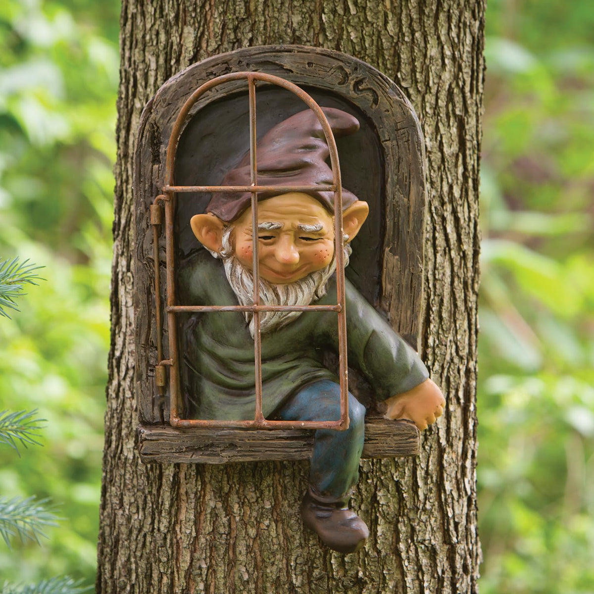 Bits and Pieces elf detail on tree hugger sculpture highlights lifelike features
