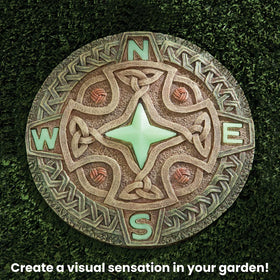 Bits and Pieces yard art stone with glow enhances walkways with subtle night lighting.