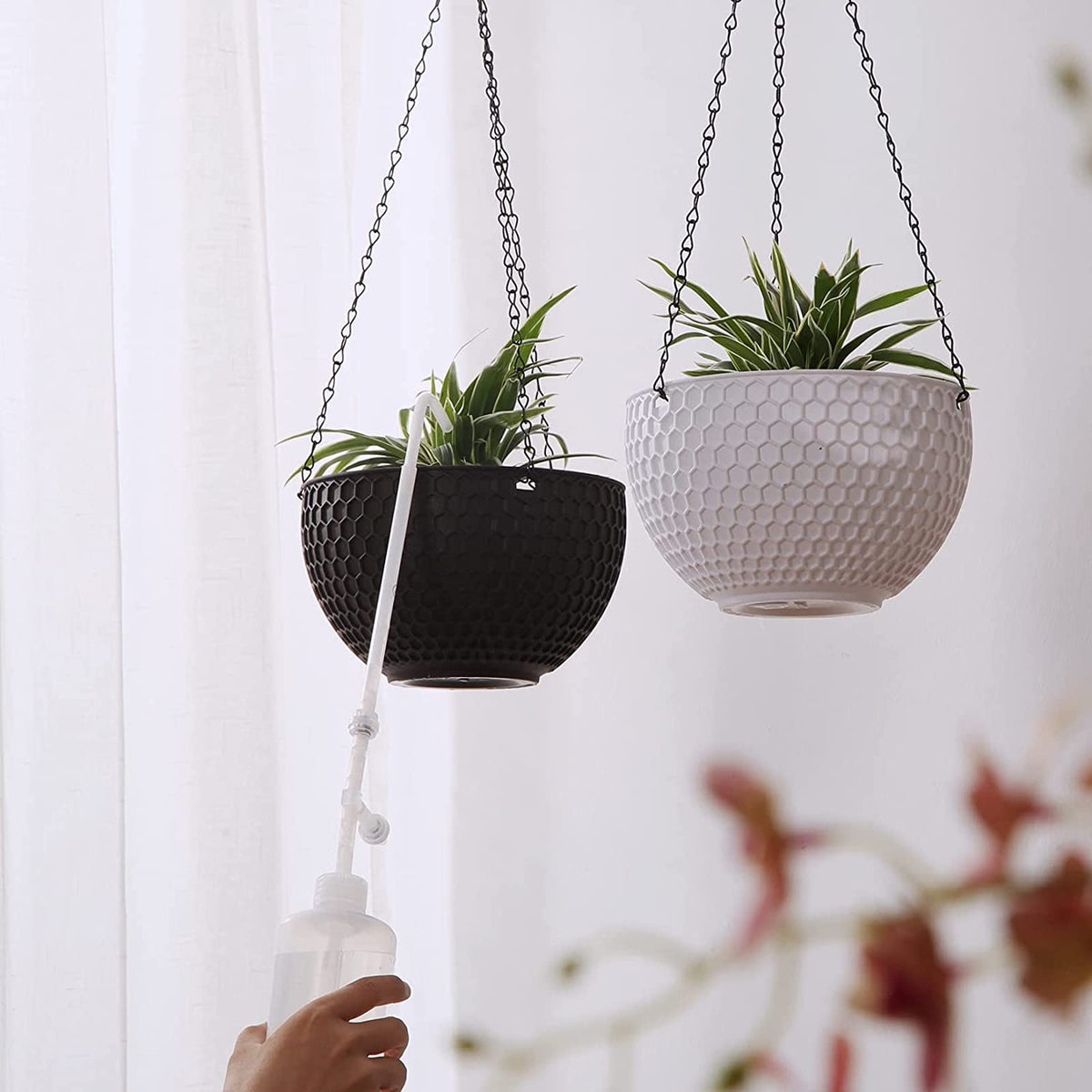 BKSAI squeezable plant watering bottle offers comfortable one- or two-handed use.