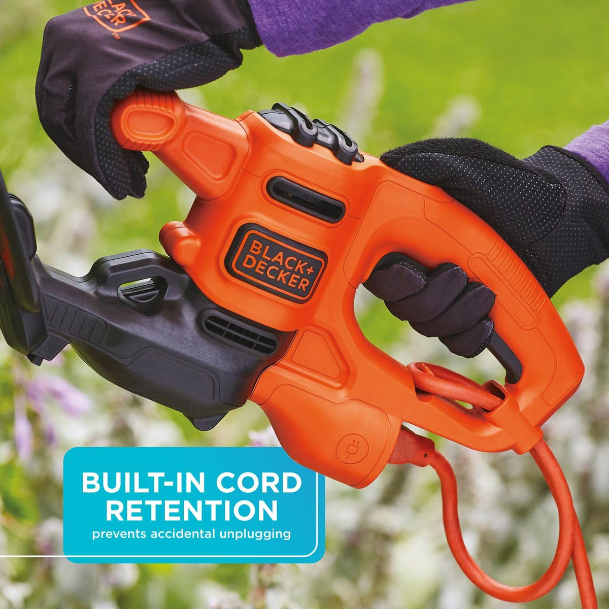 BLACK+DECKER BEHT100 in-use trimming small hedge for neat edges