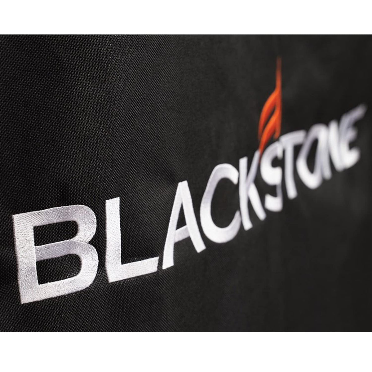 Close-up of cinch straps securing the BLACKSTONE 5482 cover