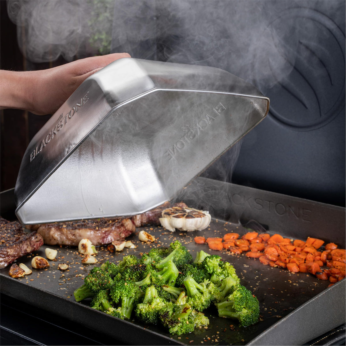 Blackstone 5555 basting cover steaming veggies to preserve flavor.