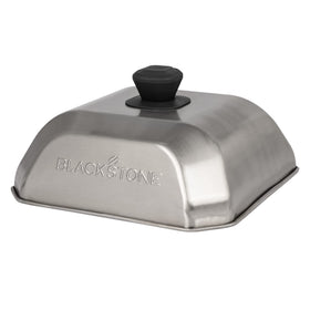 Blackstone 5555 basting cover top view traps steam to tenderize vegetables.