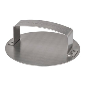 Blackstone burger press on a griddle shaping perfect patties for even burgers.
