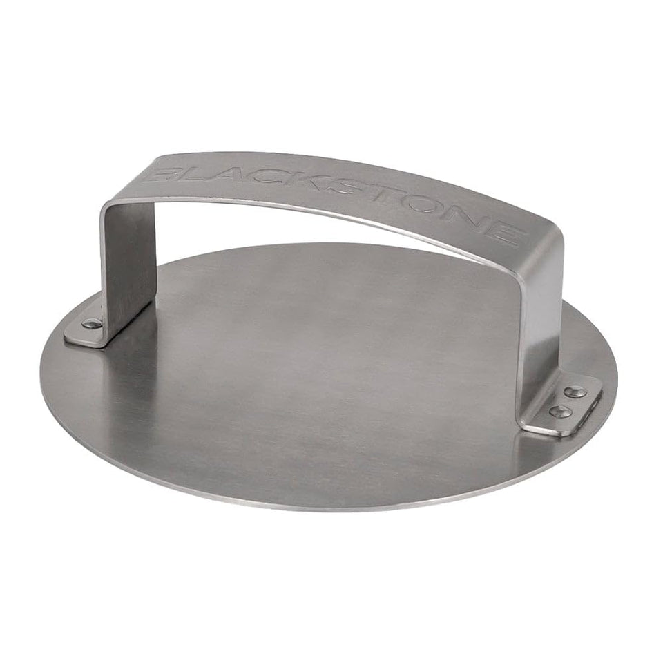 Blackstone burger press on a griddle shaping perfect patties for even burgers.