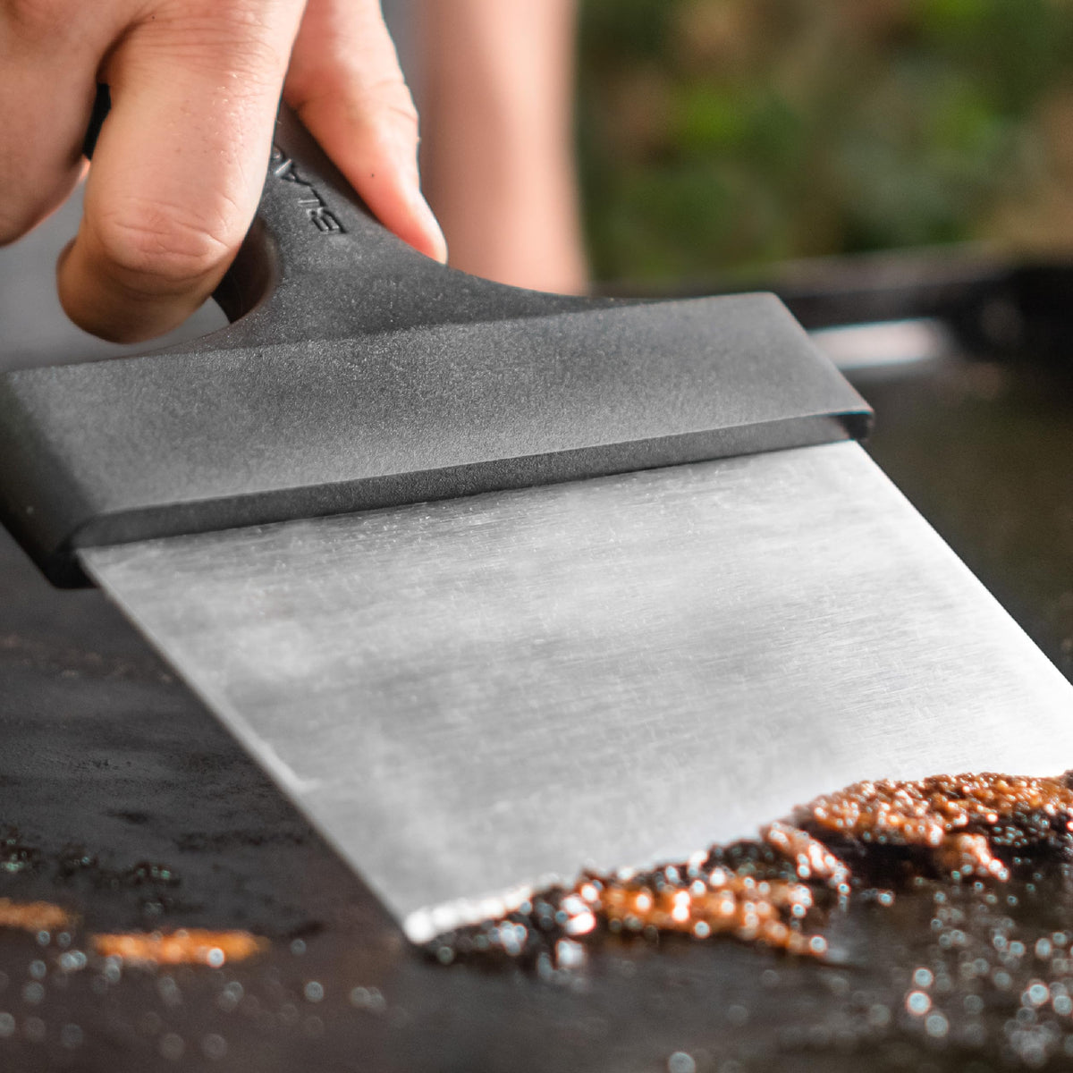 Blackstone griddle scraper hanging hole enables easy storage after use.