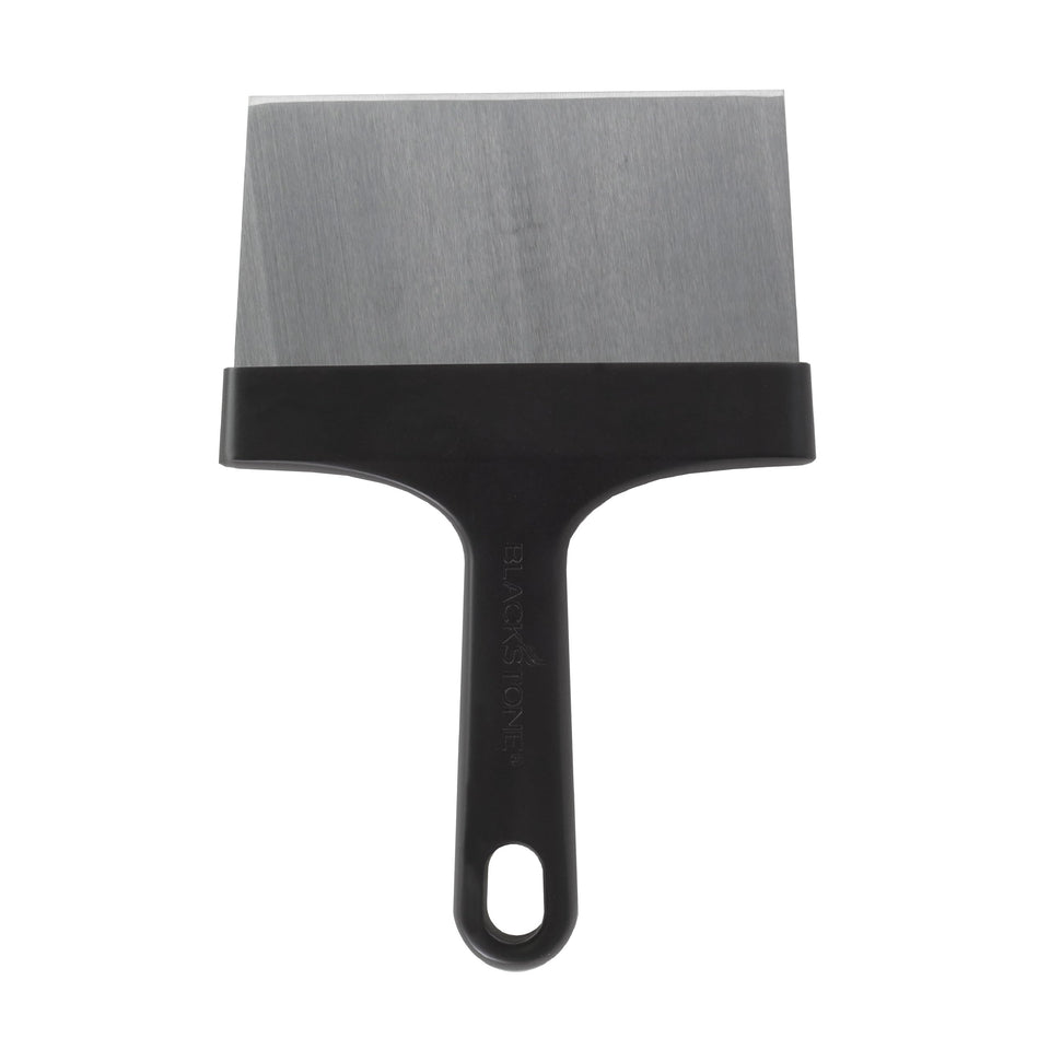 Blackstone griddle scraper with stainless steel blade removes tough grease from a flat top.
