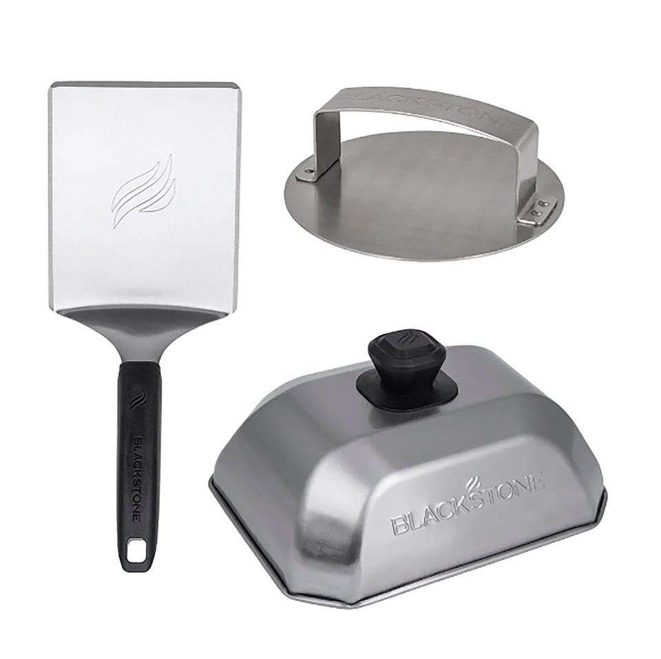 Blackstone hamburger kit spatula flipping burgers with precision on a hot griddle