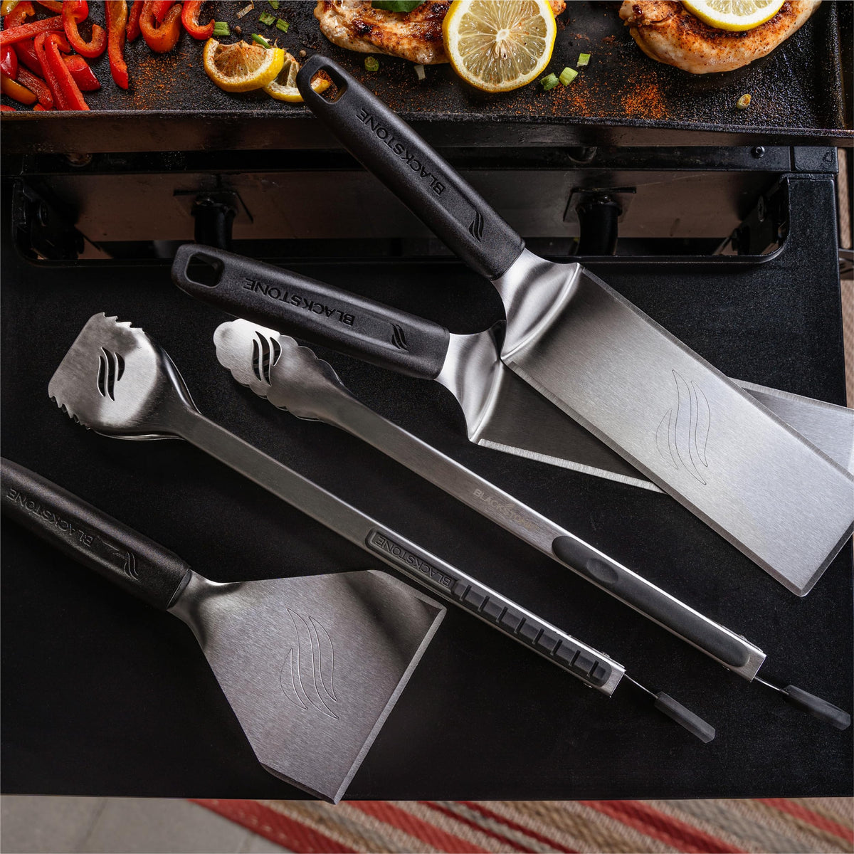 Blackstone long spatulas in use for even flipping