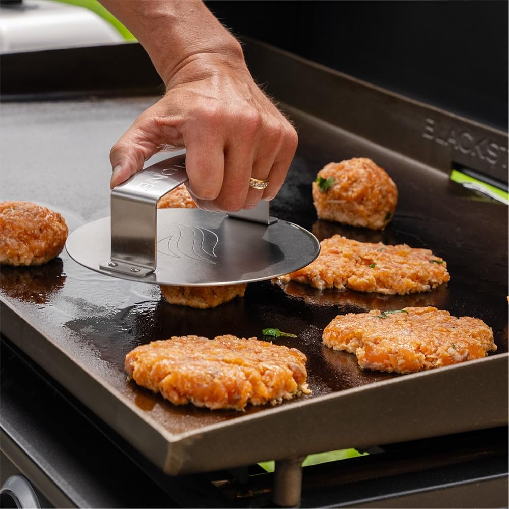 Blackstone Smash & Sear Press ergonomic handle enabling steady patty smashing.