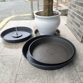 Bleuhome bird feeder setup doubles as decorative garden feature.