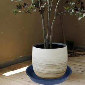 Bleuhome blue plant saucer serves as bird bath in garden