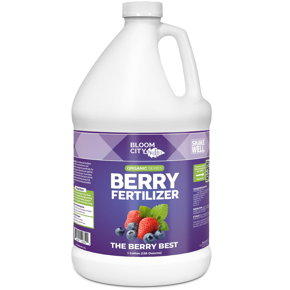 Bloom City Organic Berry Fertilizer bottle pouring to nourish blueberries and strawberries