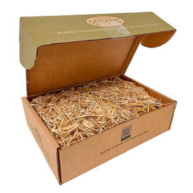 Blue Mountain Hay organic straw spread in a garden bed for even coverage