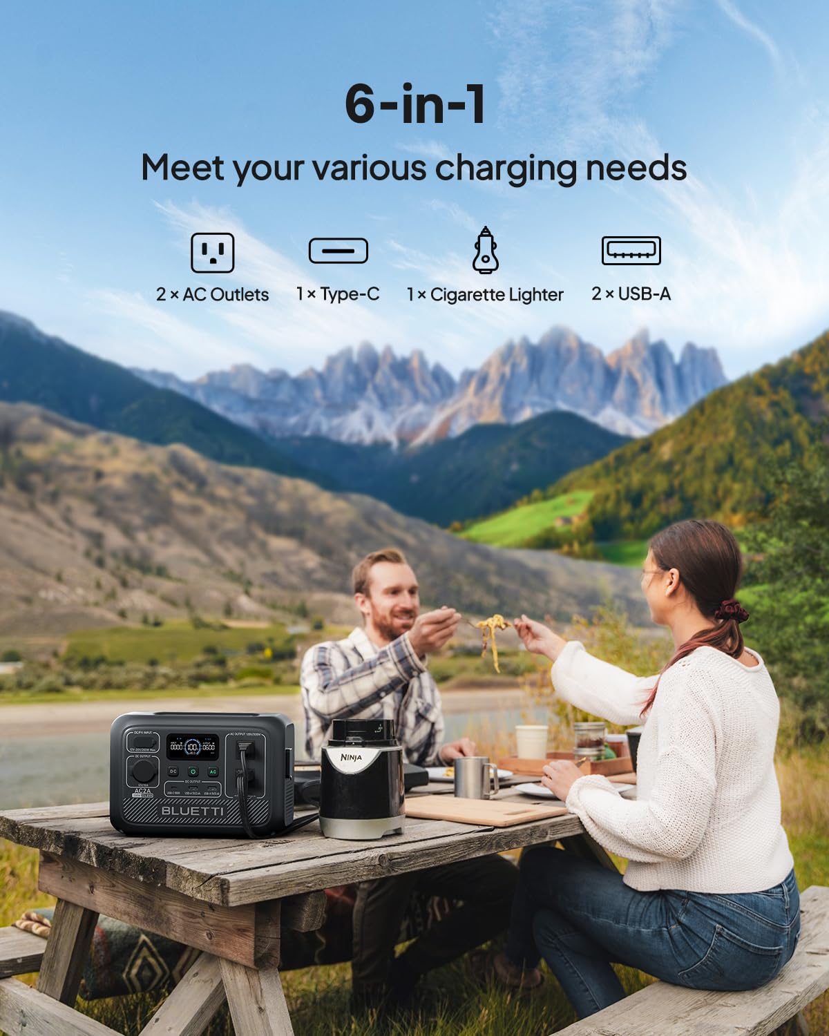 BLUETTI AC2A dual 300W outlets in use during camping setup.