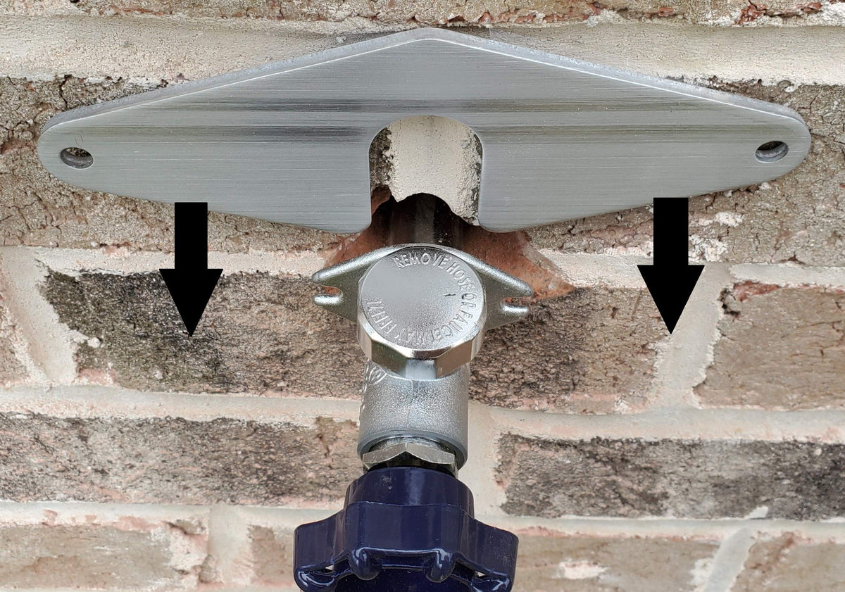 BluMare Research Hose Bib Buddy bracket on wall secures outdoor faucet for a steady connection.