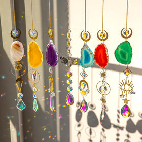 BlumWay 7-pcs crystal suncatchers set catching rainbows in sunlight indoors