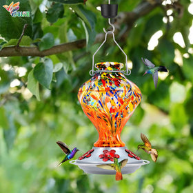 BOLITE hummingbird feeder orange-glass body adds garden color.