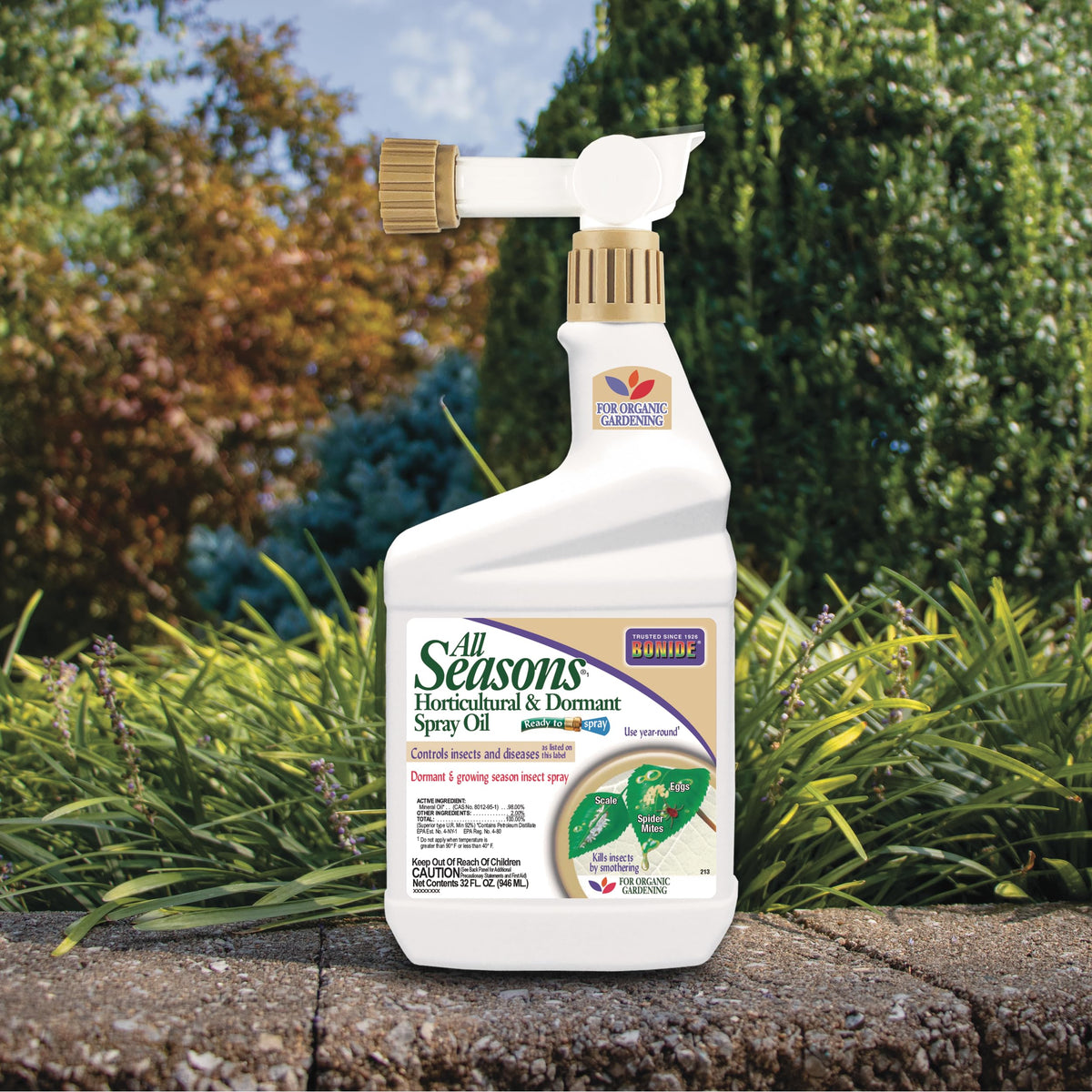 Bonide All Seasons Spray Oil green-tip application on budding tree leaves.